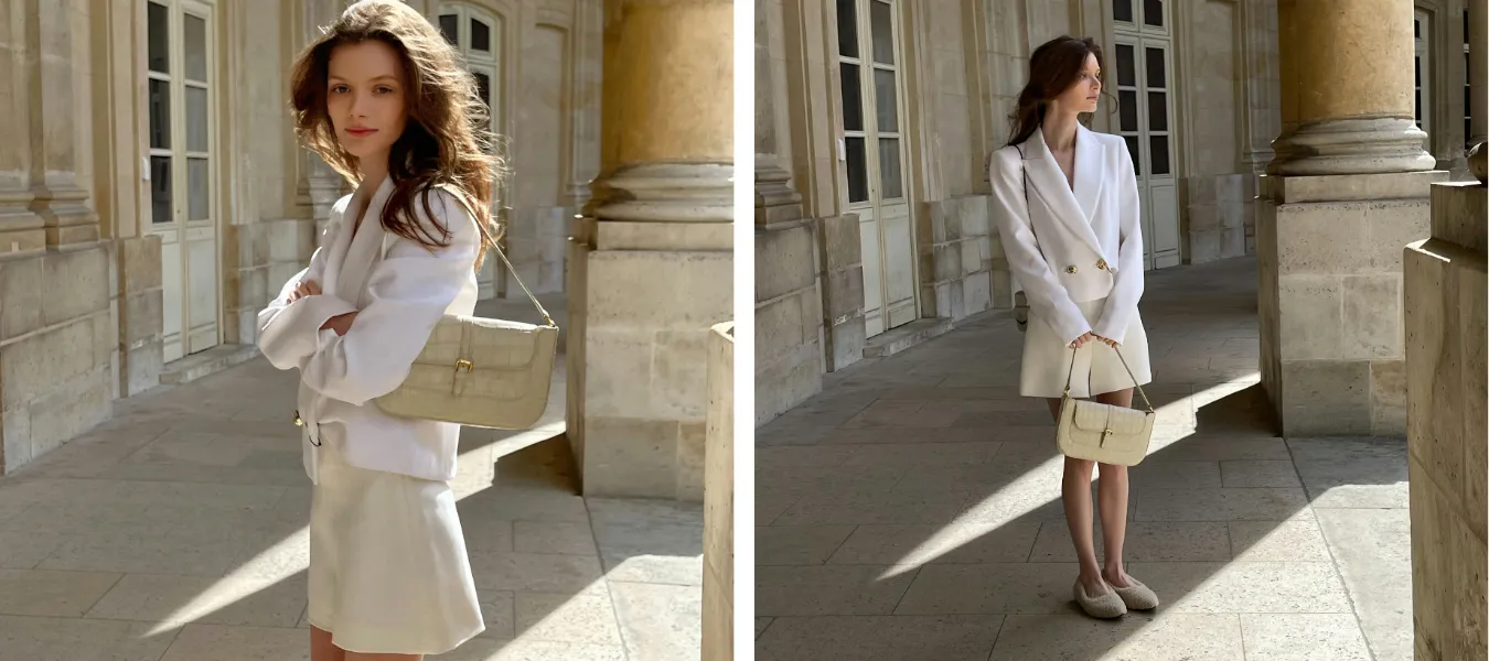 Stylizacja z białą marynarką, beżową spódnicą i beżową torebką