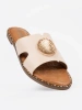 Light beige mules with a gold ornament