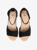 Black women's sandals on a white wedge