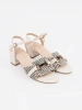 Women's white sandals on a medium block heel