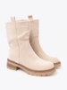 Modern light beige ankle boots in a simple style