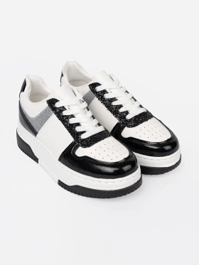 Black and white sneakers with shimmering silver details