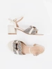 Women's white sandals on a medium block heel