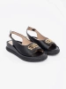Black flat sandals with embellishment