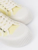 Yellow lace-up sneakers with a thick sole