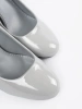 Light grey patent leather pumps