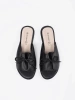 Black flat slides with a bow