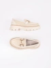 Beige platform loafers with a gold chain
