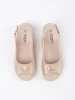 Light beige wedge sandals with a buckle