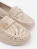 Light beige loafers with a pin