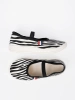 Black and white lightweight slip-on sneakers with zebra motif