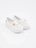 White lightweight loafers with a pin