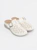 White mules with closed toe and buckle