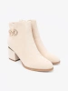 Light beige ankle boots with decorative buckle