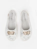White flat sandals with embellishment