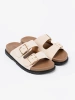 Stylish light beige slippers with suede finish