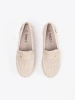 Light beige perforated loafers with a gold accent