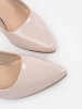 Beige patent block heel pumps