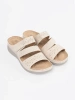 Light beige low wedge mules