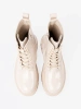 Stylish patent leather ankle boots in light beige shade