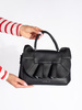 Black handbag with decorative ruffle