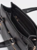 Black handbag with decorative zipper