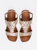 Gold sandals with openwork embellishments