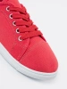 Red lace-up sneakers