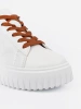 White sneakers with brown inserts