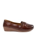 Brown slip-on loafers with a bow