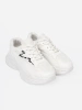 White sports shoes with a decorative accent