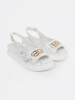 White flat sandals with embellishment