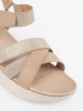 Light beige sandals on a white platform