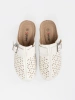 White mules with closed toe and buckle
