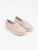 Light beige perforated loafers with a gold accent