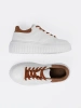 White sneakers with brown inserts