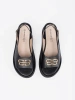 Black flat sandals with embellishment