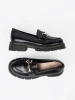 Classic black loafers with metal buckle