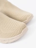 Light beige slip-on shoes made of breathable material