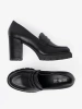 Black loafers with a column heel and jute sole