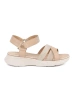 Light beige sandals on a white platform