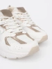 Białe sneakersy z beżowo-złotymi wstawkami