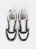Black and white sneakers with shimmering silver details