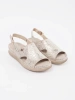 Light beige flat sandals with a buckle