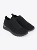 Black slip-on sports shoes with mesh upper