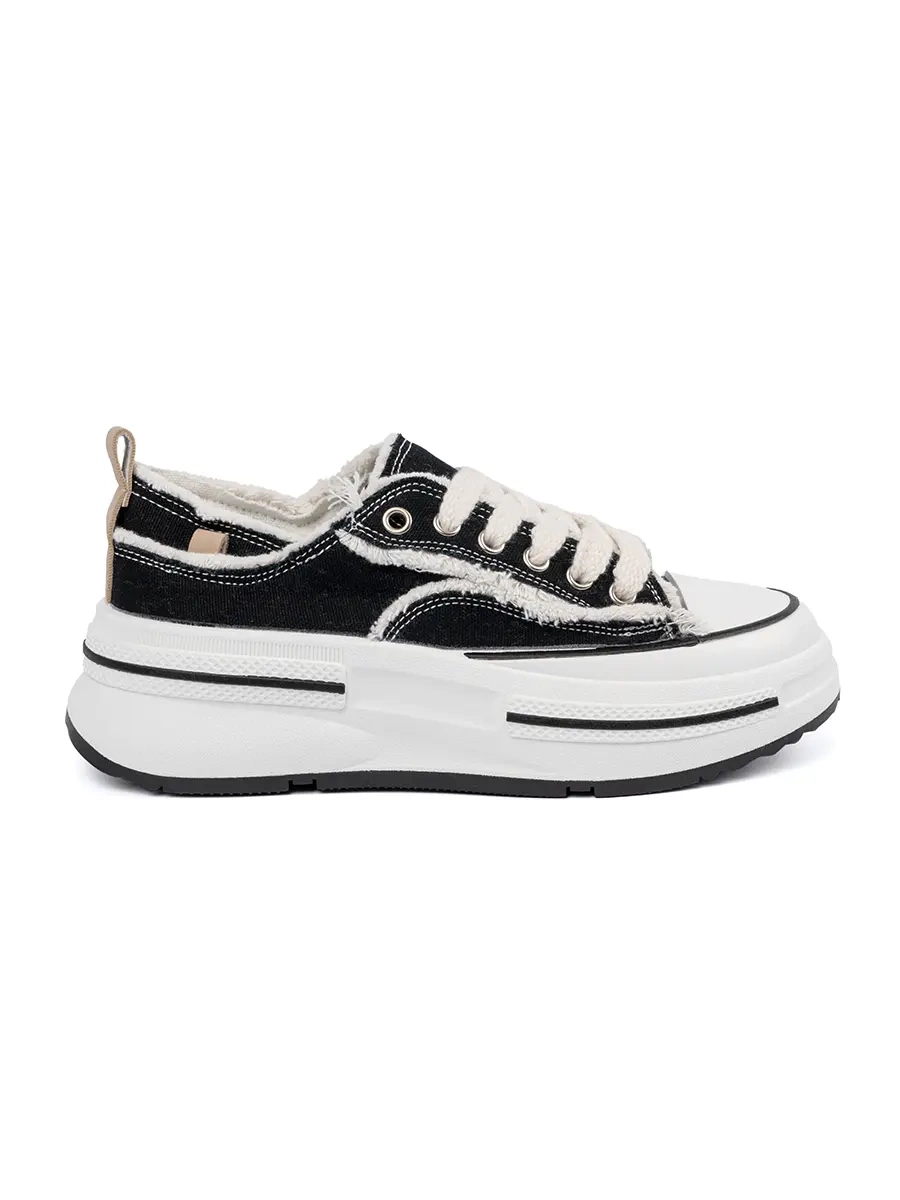 Women's black sneakers with white accents