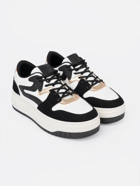 Black and white sneakers with gold details