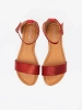 Red flat sandals with covered heel