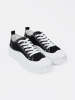 Black and white chunky sole sneakers