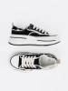 Women's black sneakers with white accents